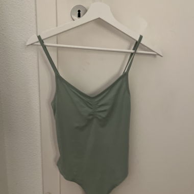 Green bodysuit with spaghetti straps