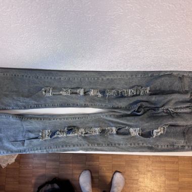 Green stone-washed flared ripped jeans