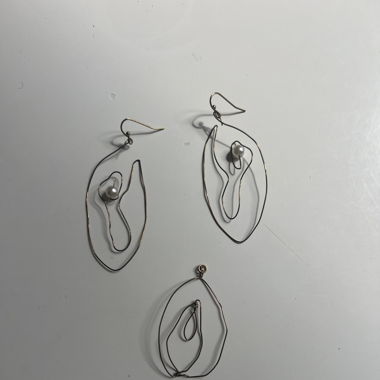 Earrings with matching charm 