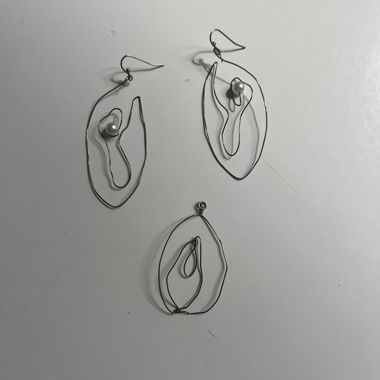 Earrings with matching charm 