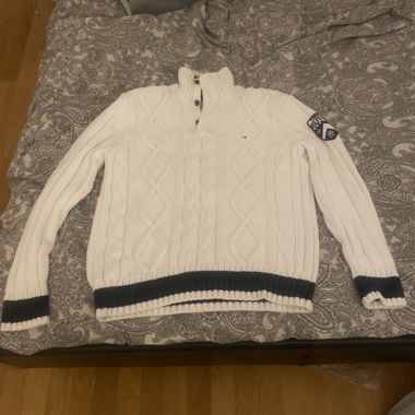 White knitted sweater with stand-up collar