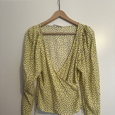 Light yellow blouse with black dots
