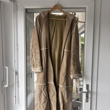 Cappotto lungo in montone rigirato