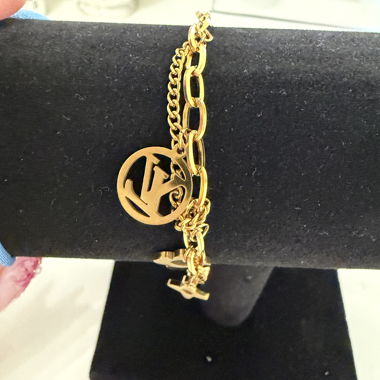 Gold-colored charm bracelet