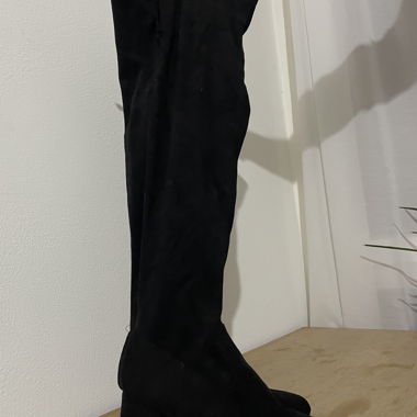 Black over-the-knee boots with heels