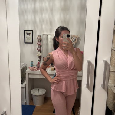 Pink two-piece set with top and trousers