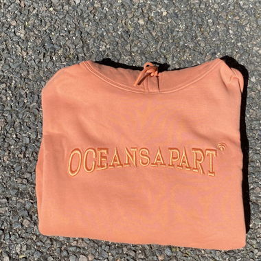 Sweat à capuche Oceansappart corail 