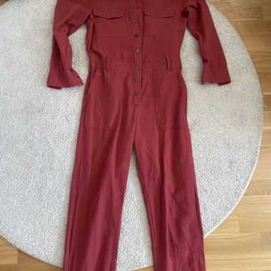 red denim jumpsuit with a belt