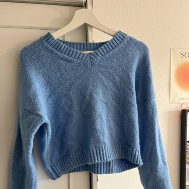 light blue sweater