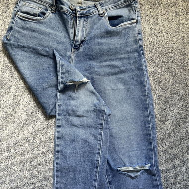 Distressed blue jeans