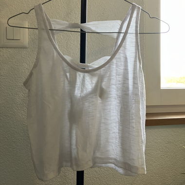 White sleeveless top with back cut-out