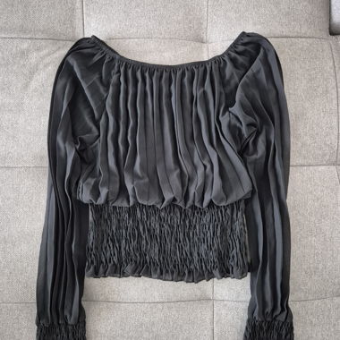 Black women’s blouse with smocked cuffs
