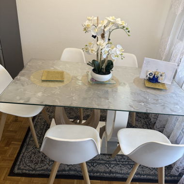 Glass dining table with 4 white chairs