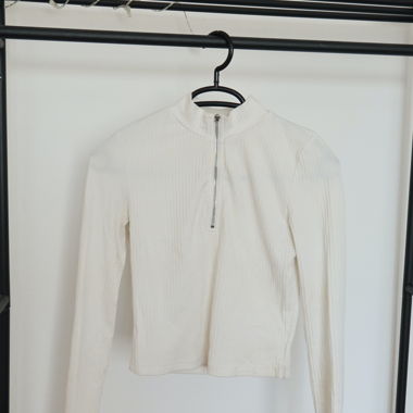 Top con zip bianco a maniche lunghe
