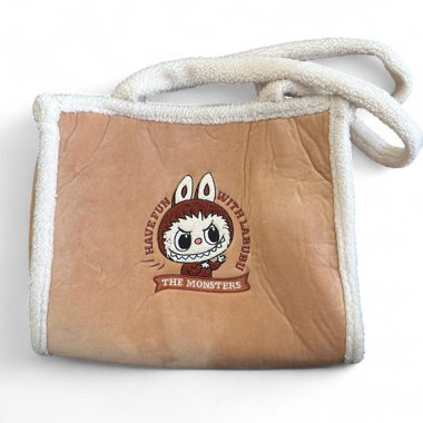 Tan and cream faux fur Labubu shoulder bag