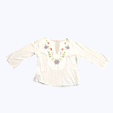 White embroidered floral blouse with a V neckline