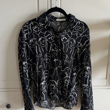 button-up with face patterns