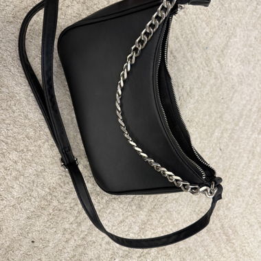 Black crossbody bag with chain