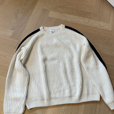 White knitted sweater with black stripes