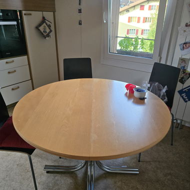 Round wooden dining table