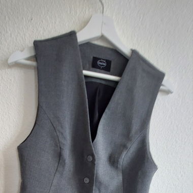 Grey sleeveless jacket