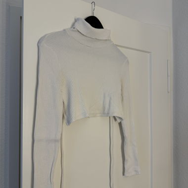 Maglione dolcevita a coste bianco