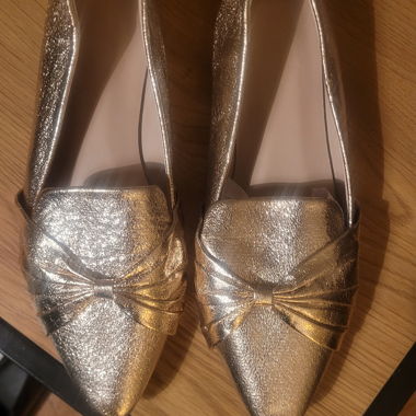 Ballerine dorate con fiocco