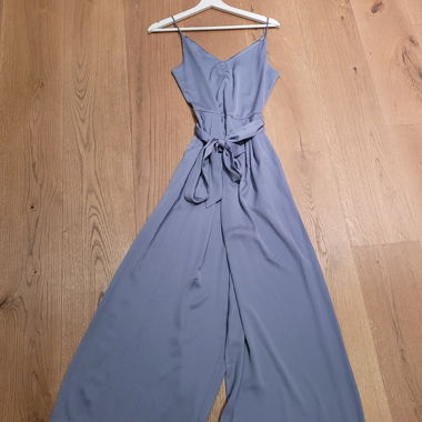 Light blue jumpsuit with tie belt