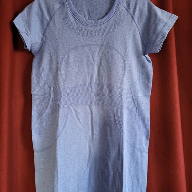 Blue women’s sports shirt by Lululemon