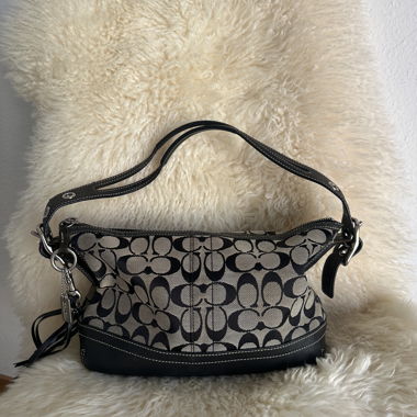 Coach black monogram hobo tassel shoulder bag