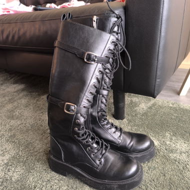 Black lace-up combat boots