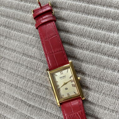 Seiko watch gold with red strap