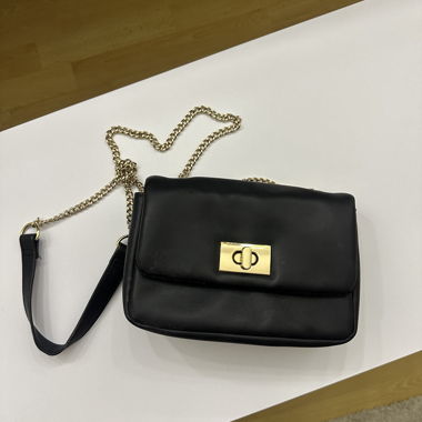 Black shoulder bag with gold chain