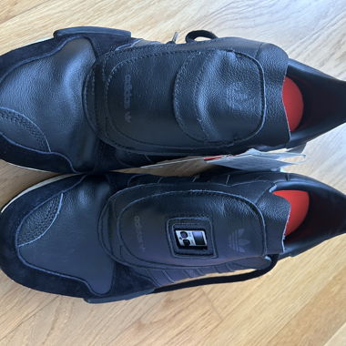 Adidas black sneakers with leather upper