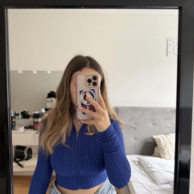 Crop top blu a coste con cerniera