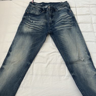 Jeans blu con lavaggio used