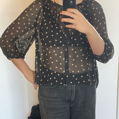Blusa nera a pois