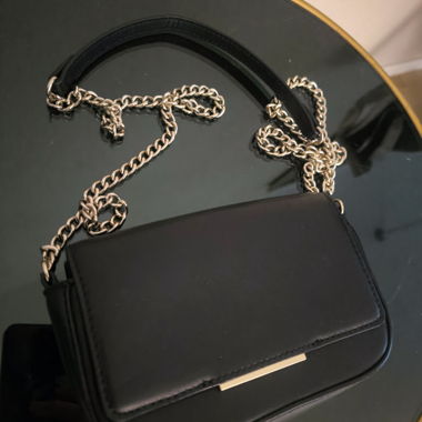 Black crossbody bag with chain