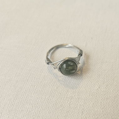 Silver ring with green stone