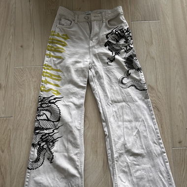 White jeans with dragons 