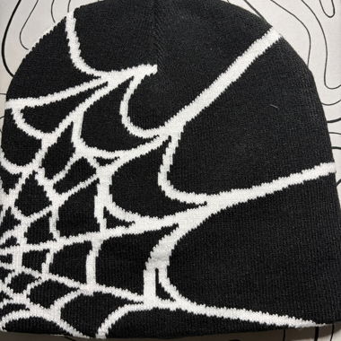 Black beanie with spiderweb pattern