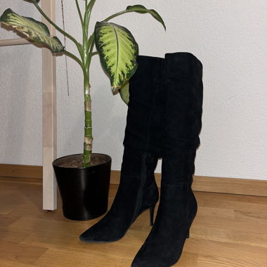 Black mid-calf boots with skinny heels