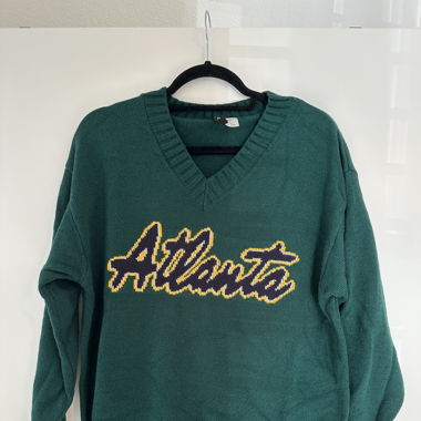 Grüner Strickpullover
