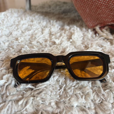Sunglasses with orange lenses