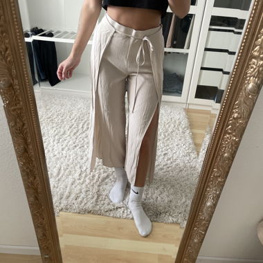 Fabric trousers with slit