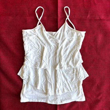 “Strange” flowy curvy white cami top