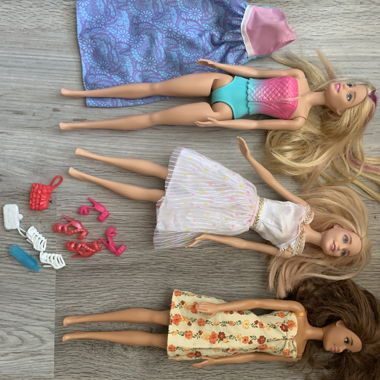 Three Barbie dolls