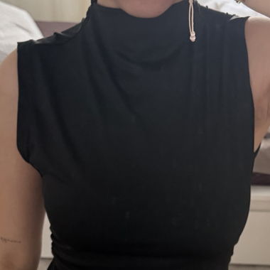 Black sleeveless bodycon dress with high neckline