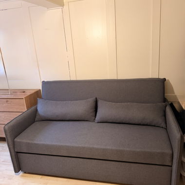 Grey pull-out sofa bed