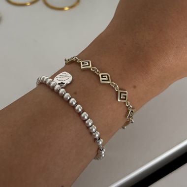 Bracciale dorato con motivo greco
